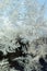 Snowflakes frost rime macro on window glass pane