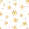 Snowflakes seamless pattern. Christmas wrapping paper with gold snowflakes. Winter design elements for textiles