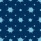 Snowflakes, spots and stars. An endlessly repeating ornament. Boom. Explosion. Seamless vector pattern. Isolated blue background.