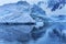 Snowing Floating Blue Iceberg Arch Reflection Paradise Bay Skintorp Cove Antarctica