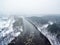 It is snowing in Vilnius, Lithuania, aerial top view of Neris river