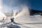 Snowmaking machine snow cannon or gun in action