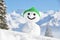 Snowman against Alpine scenery