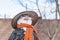 Snowman in Asian clothes, sunglasses and straw hat in the yard. Closeup