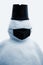Snowman in black face mask. Concept of virus quarantine