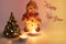 Snowman, burning candles and Christmas tree. Christmas background