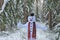 Snowman.Christmas and New Year.Snowman plays in the winter snowy forest.Cheerful snowman. Winter games.