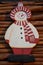 Snowman on cinnamon background