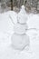 Snowman cobbled together by children