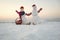 Snowman couple with present box in basket