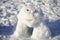 Snowman creature standing in winter landscape