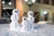 Snowman Family Decorated With Coffee Grains and Wooden Sticks