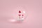 Snowman family in glass bubble with scarf and hat in pink colors. Christmas snow symbol. Minimal 3d render