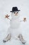 Snowman the friend is standing in winter hat and scarf with red nose. Snowman and snow day. Winter scene with snowman on