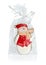 Snowman gingerbread in transparent packing with a bow.