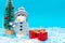 Snowman with protective mask presents and Christmas tree snow with copy space.new year celebration