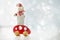 Snowman on a red toy machine rides on holiday. Merry Christmas and New Year winter background