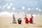 Snowman in santa hat on the sea beach. New Year and Christmas holidays. Santa Claus gifting gift. Festive header design