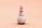 Snowman with scarf and hat in pink colors. Christmas snow symbol. Minimal 3d render