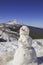 A snowman on the summits of Tenerife. Canary Islands. In the background the Teide volcano snowed