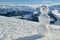 Snowman on top of Mount Rigi with beautiful views on Swiss Alps