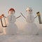 Snowman in winter outdoor. Building and repair work. Snowman builder in winter in helmet. Christmas or xmas decoration.