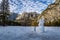 Snowman at Yosemite Valley during winter with Upper Yosemite Falls on background - Yosemite National Park, California, USA