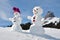 Snowmen against Swiss Alps