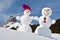 Snowmen against Swiss Alps