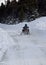 Snowmobile on snow covered road