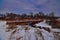 Snowmobile trail bridge mount vernon creek winding through the oak trees and fields of Donald County park mount vernon wisconsin