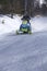 Snowmobilers ride on a trail on Bald Mountain, Rangeley, Maine.