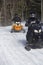 Snowmobilers ride on a trail on Bald Mountain, Rangeley, Maine.