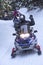 Snowmobilers ride on a trail on Bald Mountain, Rangeley, Maine.