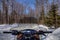 Snowmobiling through the Woods of Northern Minnesota in Winter
