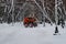 Snowplow cleans from the road snow on Tverskoy boulevard in Moscow