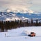 Snowplow clearing road in scenic Yukon T Canada