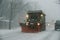 Snowplow in developing New England snowstorm