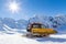 Snowplow in the mountains prepairing piste