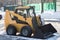 A snowplow removes snow from the roads.