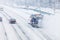 Snowplow removing the Snow from the Highway during a Snowstorm