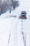 Snowplow removing the Snow from the Highway during a Snowstorm