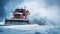 Snowplow truck clearing snowy road during blizzard