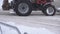 Snowplows on the road in the city, a lot of snow, winter, urban, slow motion, tractor