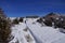 Snowshoe hikers ascend a hill