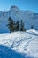 Snowshoe tracks and snow-covered mountains near Mt Baker, WA