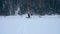 Snowshoeing across a snow filled frozen alpine lake