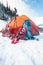 Snowshoes and a backpack near the tent.