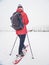 Snowshoes hiker walk at horse farm. Winter season