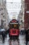 Snowstorm over a tram on Istiklal street, main pedestrian street of Istanbul, Turkey.